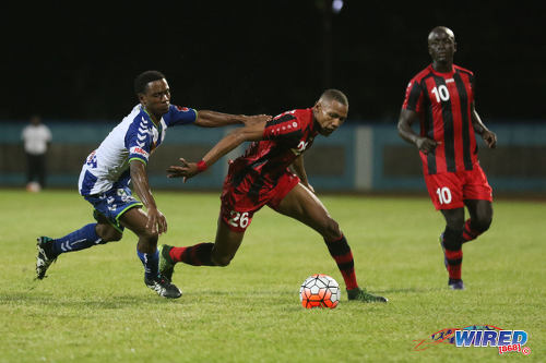 Photo: Inter Moengo Tapoe attacker Stefano Rijssel (centre) turns on a Club Sportif defender during 2016 Caribbean Club Championship action last night in Couva. (Courtesy Chevaughn Christopher/Wired868