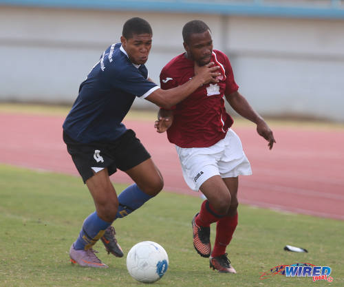 Photo: Bethel United right back Daniel Craig (left) tries to hold off La Horquetta SA midfielder Kern Roberts during 2015/16 CNG NSL Premiership Division action. (Courtesy Nicholas Bhajan/Wired868)