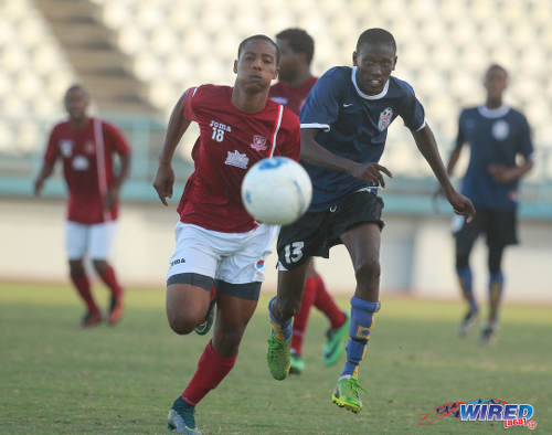 Photo: Bethel United's teenaged winger Teejay Cadiz (right) chases a La Horquetta SA opponent for the ball during 2015/16 CNG NSL Premiership Division action. (Courtesy Nicholas Bhajan/Wired868)