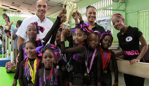 Photo: TTGF second vice-president Ricardo Lue Shue (back left) poses with young gymnasts in Trinidad and Tobago. (Copyright TT Sportslink)