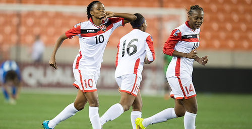 Photo: Trinidad and Tobago goal scorer Tasha St Louis (left) and teammate Karyn Forbes (right) celebrate during their 2-1 Rio Olympic qualifying win over Guatemala last night in Houston. (Courtesy CONCACAF)