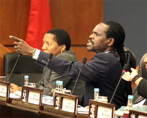 Photo: Minister of Public Utilities and ex-Works and Transport Minister Fitzgerald Hinds (right). (Copyright Power 102)