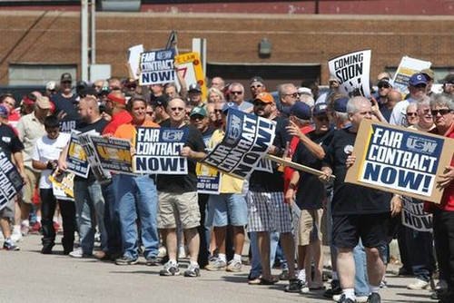 Photo: Steel workers protest at an ArcelorMittal plant in Chicago. (Copyright Chicago Times)