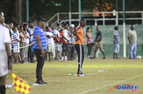 Photo: San Juan Jabloteh coach Keith Jeffrey (right) and Defence Force coach Marvin Gordon look on during Pro League action on 12 March 2016 at the Barataria Recreation Ground. (Courtesy Nicholas Bhajan/Wired868)