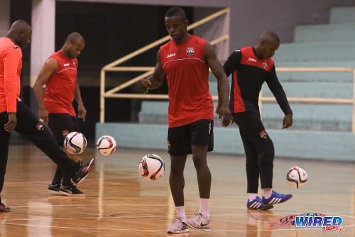 Photo: Kareem Perry (centre) and his teammates juggle the ball during Trinidad and Tobago National Futsal Team practice in March 2016. (Courtesy Chevaughn Christopher/CA-images/Wired868)