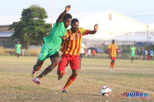 Photo: San Juan Jabloteh right back Garth Thomas (left) tries to get around Point Fortin Civic left back Shaquille Stewart during TT Pro League action at the Barataria Recreation Ground, Barataria on 5 March 2016. (Courtesy Chevaughn Christopher/Wired868)