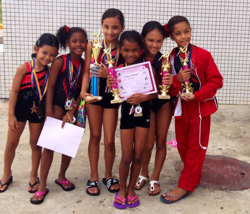 Photo: Young Tots and Tumblers gymnasts show off their winnings.