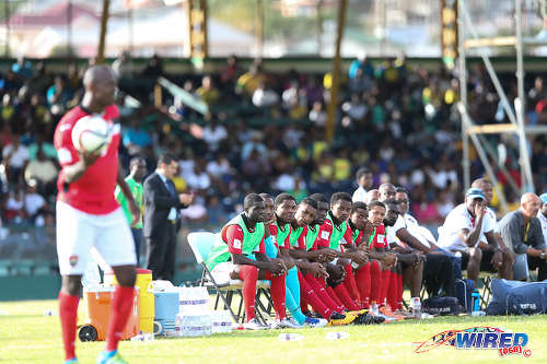 Photo: The Trinidad and Tobago substitutes' bench looks on as right back Daneil Cyrus (left) prepares to take a throw during Russia 2018 World Cup qualifying action at Arnos Vale on 25 March 2016. Trinidad and Tobago won 3-2. (Courtesy Allan V Crane/CA-images/Wired868)