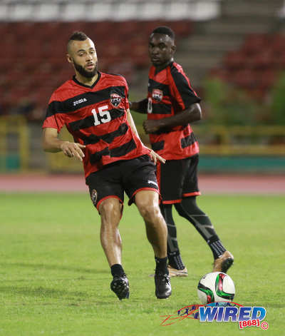 Photo: Trinidad and Tobago midfielder John Bostock (left) trains with the national team while Trevin Caesar looks on at the Hasely Crawford Stadium on 21 March 2016. (Courtesy Nicholas Bhajan/Wired868)