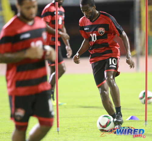 Photo: Trinidad and Tobago international midfielder Kevin Molino (right) trains with his teammates at the Hasely Crawford Stadium on 21 March 2015. (Courtesy Nicholas Bhajan/Wired868)