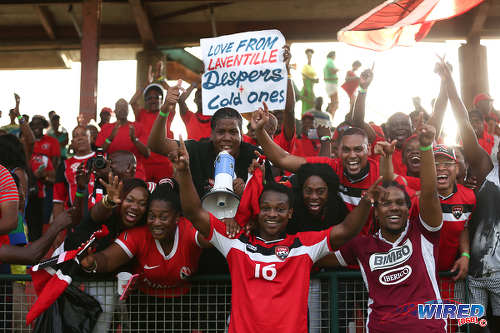 Photo: Eighteen year old Trinidad and Tobago winger Levi Garcia (right) celebrates with "Soca Warriors" fans after his double set up a 3-2 World Cup qualifying win over St Vincent and the Grenadines at Arnos Vale on 25 March 2016. (Courtesy Allan V Crane/CA-images/Wired868)