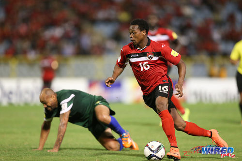 Photo: Trinidad and Tobago winger Levi Garcia (right) leaves St Vincent and the Grenadines defender Shawn Benjamin for dead during Russia 2018 World Cup qualifying action at the Hasely Crawford Stadium, Port of Spain on 29 March 2016. Trinidad and Tobago won 6-0. (Courtesy: Allan V Crane/CA-images/Wired868)