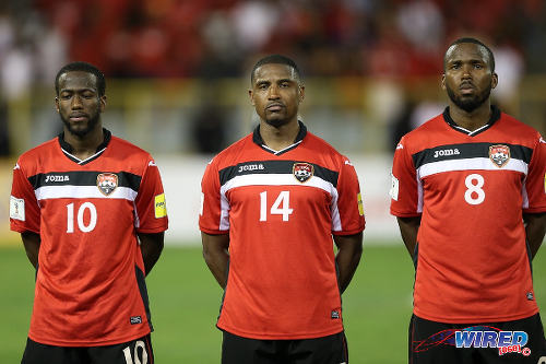 Photo: Trinidad and Tobago midfielders (from left) Kevin Molino, Andre Boucaud and Khaleem Hyland prepare for kick off against St Vincent and the Grenadines in Russia 2018 World Cup qualifying action at the Hasely Crawford Stadium, Port of Spain on 29 March 2016. Trinidad and Tobago won 6-0. (Courtesy: Allan V Crane/CA-images/Wired868)