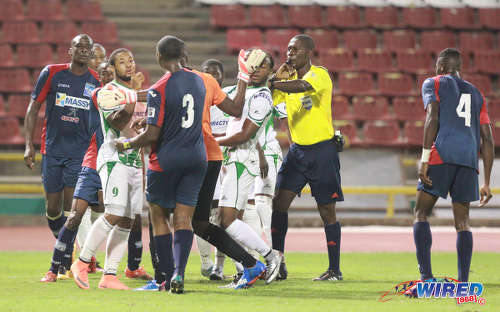 Photo: Morvant Caledonia United and Barbados international defender Ranaldo Bailey (number 3) and W Connection forward Shahdon Winchester (second from left) exchange pleasantries during the Lucozade Sport Goal Shield final on 21 April 2016. Caledonia won 4-1 on kicks from the penalty mark. (Courtesy Nicholas Bhajan/Wired868)