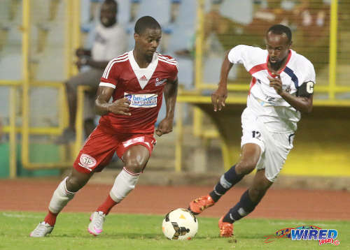 Photo: Central FC defender Kevon Villaroel (left) takes on Morvant Caledonia United captain Kareem Joseph during Pro League on 19 April 2016 at the Hasely Crawford Stadium. Central won 3-0. (Courtesy Nicholas Bhajan/Wired868)