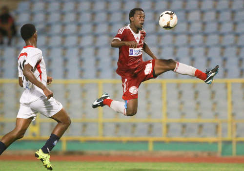 Photo: Central FC forward Marcus Joseph (right) goes airborne to control a pass while Morvant Caledonia United player Antonio Joseph looks on during Pro League on 19 April 2016 at the Hasely Crawford Stadium. Central won 3-0. (Courtesy Nicholas Bhajan/Wired868)