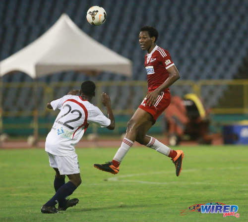 Photo: Central FC forward Ricardo John (right) heads the ball while Morvant Caledonia United flanker Jameel Neptune looks on during Pro League on 19 April 2016 at the Hasely Crawford Stadium. Central won 3-0. (Courtesy Nicholas Bhajan/Wired868)