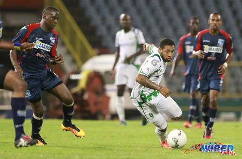 Photo: W Connection attacker Shahdon Winchester (centre) tries to turn towards goal during the Lucozade Sport Goal Shield final against Morvant Caledonia United on 24 April 2016. Caledonia won 4-1 on kicks from the penalty mark. (Courtesy Nicholas Bhajan/Wired868)