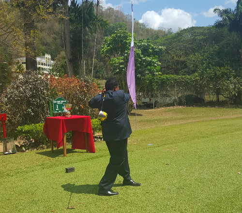 Photo: Sport Minister Darryl Smith tees off at the Open Golf competition. (Courtesy Ministry of Sport)