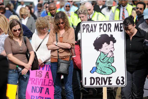 Photo: Canadian mourners protest at the site of a fatal accident on Highway 63. (Copyright Edmonton Journal)