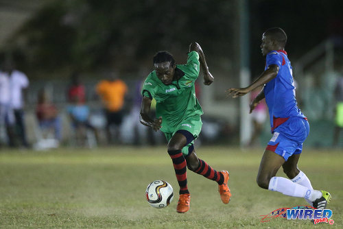 Photo: San Juan Jabloteh winger Nathan Lewis (left) tries to evade St Ann's Rangers defender Shakiyl Phillip during Pro League action at the Barataria Recreation Ground on 2 April 2016. Phillip will also represent Jabloteh in 2017. (Courtesy Allan V Crane/CA-images/Wired868)