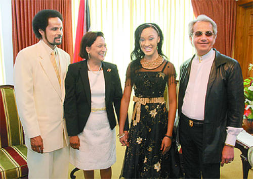 Photo: Then Prime Minister Kamla Persad-Bissessar (second from left) poses with (from left) Pastor Winston Cuffie, his daughter Winsie-Ann Cuffie and US evangelist Benny Hinn. (Copyright Trinidad Guardian)