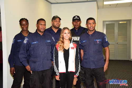 Photo: Trinidad and Tobago gymnast Marisa Dick (centre) was accompanied by five police officers at the Trinidad and Tobago Gymnastics Federation (TTGF) press conference on 20 April 2016 at the Chamber of Commerce in Westmoorings. (Courtesy Wired868)