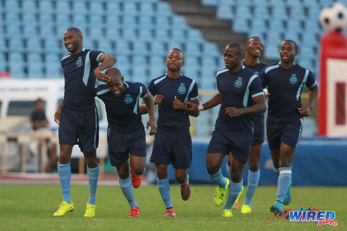 Photo: Police FC forward Makesi Lewis (far left) celebrates with his teammates during Lucozade Sport Goal Shield quarterfinal action against San Juan Jabloteh on 9 April 2016. Police won 3-0. (Courtesy Nicholas Bhajan/Wired868)