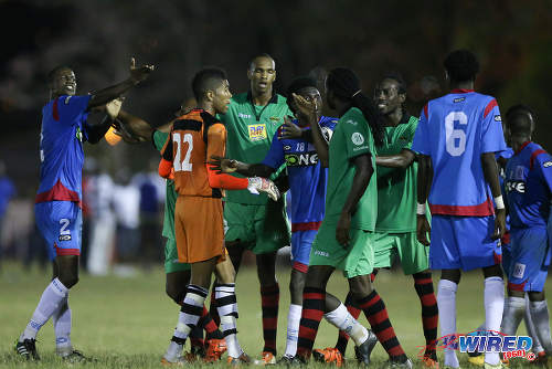 Photo: St Ann's Rangers defender Shakiyl Phillip (far left) gesticulates towards San Juan Jabloteh midfielder Keyon Edwards (centre) during Pro League action at the Barataria Recreation Ground on 2 April 2016. (Courtesy Allan V Crane/CA-images/Wired868)