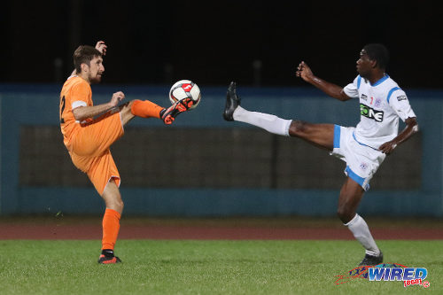 Photo: Club Sando's Jack Weedon and St Ann's Rangers' Sedale McLean contest the ball during Lucozade Sport Goal Shield qualifying action on 5 April 2016 at the Ato Boldon Stadium, Couva (Courtesy Chevaughn Christopher/CA-images/Wired868)