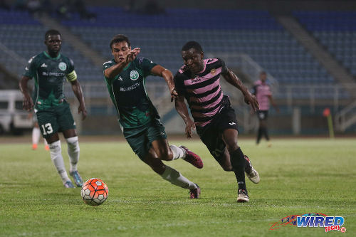 Photo: W Connection midfielder Paolo De La Guardia (left) tries to keep up with North East Stars midfielder Neil Mitchell during Lucozade Sport Goal Shield quarterfinal action on 8 April 2016. Connection won 4-1. (Courtesy Chevaughn Christopher/CA-Images/Wired868)