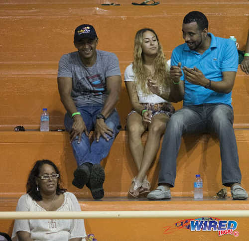 Photo: Trinidad and Tobago gymnast Marisa Dick (centre) talks to Trinidad and Tobago Gymnastics Federation (TTGF) first vice-president Akil Wattley (right) at a local gymnastics meet at the Tacarigua Indoor Sporting Facility on 23 April 2016. Looking on (bottom left) is Dick's mother, Hannifer Dick. (Courtesy Wired868)