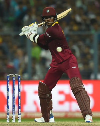 Photo: West Indies and Jamaica all-rounder Marlon Samuels plays a shot during the World T20 cricket tournament final match between England and West Indies at The Eden Gardens Cricket Stadium in Kolkata on 3 April 2016. Samuels was the man of the match as West Indies won by four wickets. (Copyright AFP2016/Dibyangshu Sarkar)