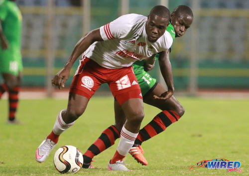 Photo: Central FC utility player Jamal Jack (left) tries to hold off San Juan Jabloteh midfielder Fabian Reid during Pro League action on 17 May 2016 at the Hasely Crawford Stadium in Port of Spain. Jabloteh won 3-2. (Courtesy Nicholas Bhajan/Wired868)