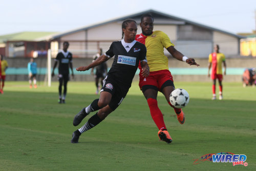 Photo: Central FC midfielder Nathaniel Garcia (left) and North East Stars defender Jesus Perez contest the ball during Pro League action at the Mannie Ramjohn Stadium on 8 May 2016. Central won 4-0 to retain the Pro League title. (Courtesy Chevaughn Christopher/Wired868)