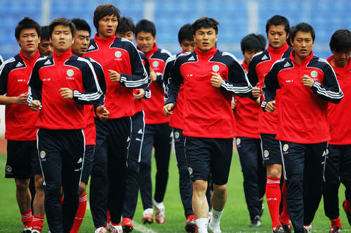 Photo: The China National Senior Team gets warmed up at a training session. (Copyright Al Azeera)