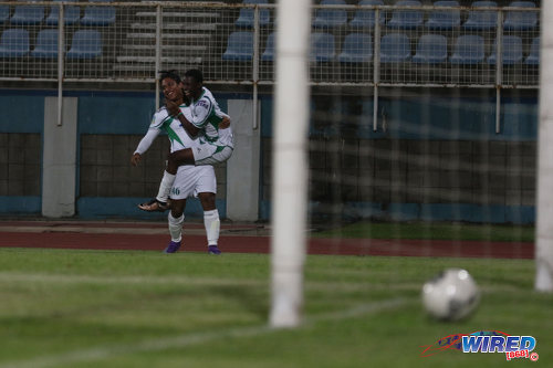 Photo: W Connection striker Anfernee Frederick (left) is congratulated by teammate Dimitrie Apai during Pro Bowl quarterfinal action at the Ato Boldon Stadium on 10 May 2016. Frederick scored the winner as Connection edged Police FC 4-3. (Courtesy Chevaughn Christopher/Wired868)