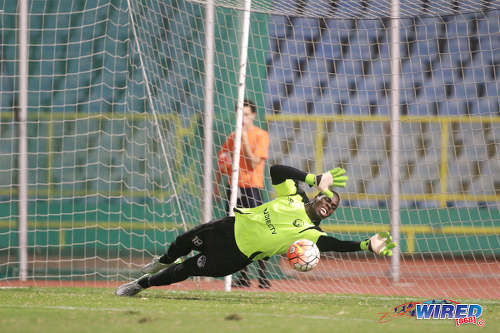 Photo: W Connection goalkeeper Julani Archibald dives to his left to keep out a penalty from North East Stars midfielder Kerry Daniel during the 2016 Pro Bowl semifinal on May 13 at the Hasely Crawford Stadium in Port of Spain. Connection won 4-2 on kicks from the penalty spot. (Courtesy Nicholas Bhajan/Wired868)