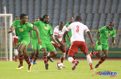 Photo: San Juan Jabloteh midfielder Keyon Edwards (centre) ponders his options against Central FC with teammates Jamal Gay (far left) and Fabian Reid (far right) bursting into space during Pro League action on 17 May 2016 at the Hasely Crawford Stadium in Port of Spain. Jabloteh won 3-2. (Courtesy Nicholas Bhajan/Wired868)