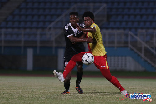 Photo: North East Stars midfielder Jean-Luc Rochford (right) tries to hold off Central FC forward Ricardo John during Pro Bowl quarterfinal action at the Ato Boldon Stadium on 10 May 2016. Stars won 2-1. (Courtesy Chevaughn Christopher/Wired868)