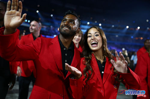 Photo: Trinidad and Tobago gymnasts Marisa Dick (right) wave to the crowd during the Opening Ceremony of the Toronto 2015 Pan-American Games at Rogers Stadium, Toronto in July 2015. (Courtesy Allan V Crane/Wired868)