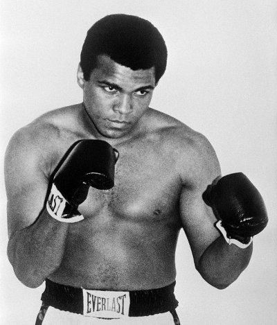 Photo: Former US boxing champion Muhammad Ali, then known as Cassius Clay, poses on 1 January 1965. Ali died on Friday 3 June 2016, at the age of 74, after a 32-year battle with Parkinson’s disease. (Copyright Pigiste/AFP 2016)