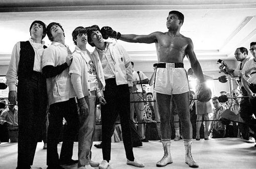 Photo: Then world heavyweight boxing contender Cassius Clay (right) clowns around with The Beatles on 18 February 1964. The Beatles had hoped to meet reigning champion Sonny Liston and not, as John Lennon put it: "that loudmouth who's going to lose." Liston turned them down and they met Clay instead. Days later Clay became the heavyweight champion of the world and, later as Muhammad Ali, become one of the 20th century's most famous persons. (Copyright Harry Benson)