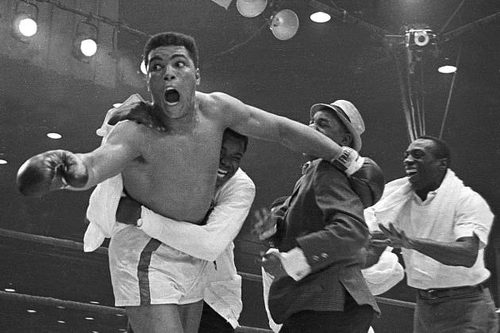 Photo: Muhammad Ali, then Cassius Clay (left), celebrates after his stunning win over Sonny Liston for the world heavyweight title. (Courtesy Bleacher Report)