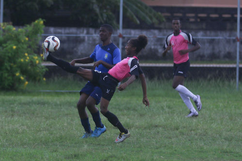 Photo: Crown Trace midfielder Dylon Roseman (right) controls the ball under pressure from a FC Santa Rosa player during Under-16 action on 11 June 2016 in the Republic Bank National Youth League. (Courtesy Chevaughn Christopher/Wired868)