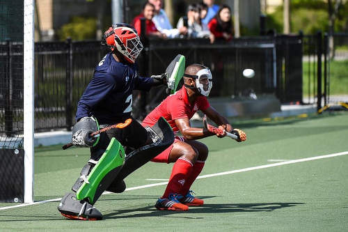 Photo: Trinidad and Tobago goalkeeper Kwasi Emmanuel (left) and Jordan Reynos in action at the Toronto 2016 Pan American Men's Junior Hockey Championships.