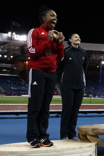 Photo: Trinidad and Tobago’s Cleopatra Borel (left) celebrates her silver finish at the Glasgow 2014 Commonwealth Games alongside gold medalist Valerie Adams (New Zealand) at Hampden Park on 30 July 2014. (Copyright Adrian Dennis/AFP 2016/Wired868)