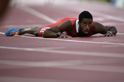 Photo: Trinidad and Tobago 40 metre hurdler Jehue Gordon lies on the track during the 2014 Commonwealth Games in Hamden, Scotland. (Copyright AFP 2016)