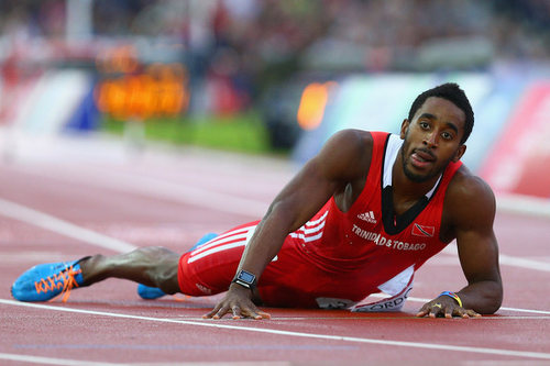 Photo: Trinidad and Tobago 40 metre hurdler Jehue Gordon lies on the track during the 2014 Commonwealth Games in Hamden, Scotland. (Copyright Zimbio)