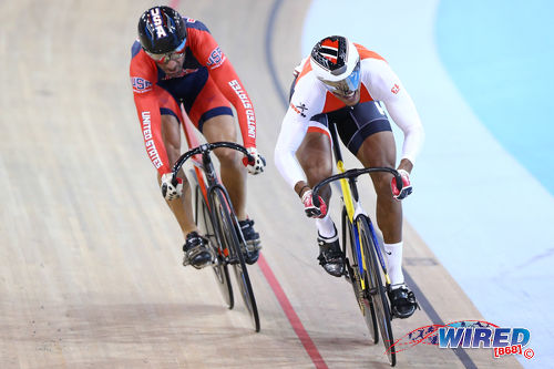 Photo: Trinidad and Tobago cyclist Njisane Phillip (right) sets the pace during battle with United States rider David Espinoza during the Toronto 2015 Pan American Games. (Courtesy Allan V Crane/CA Images/Wired868)